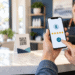 Customer using a smartphone to leave a five-star business review